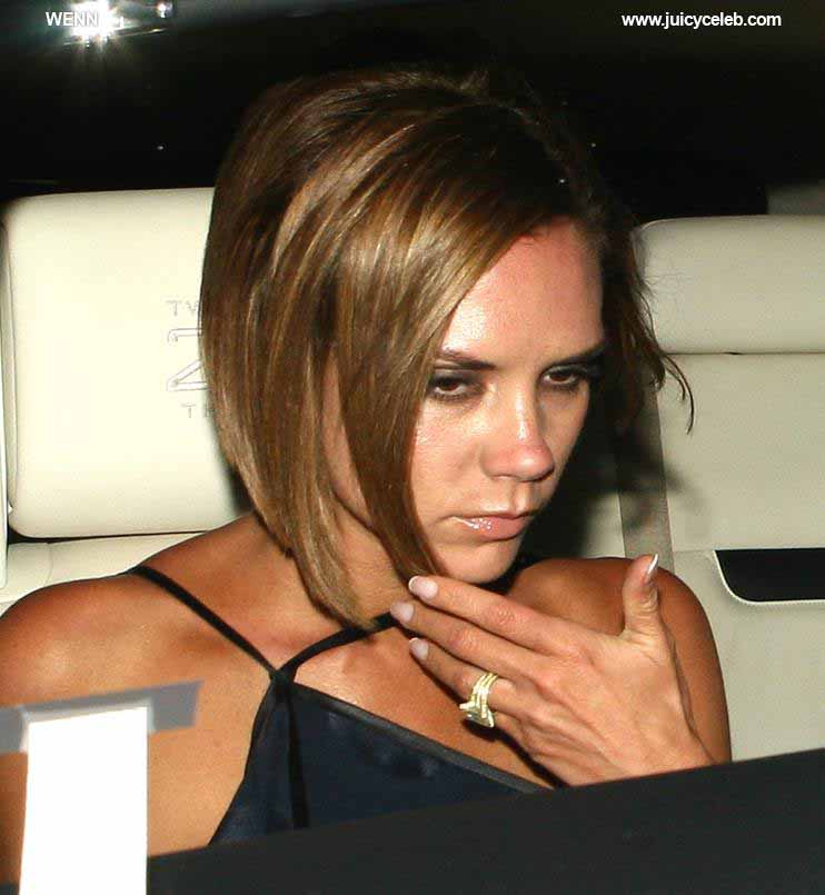 Victoria Beckham leaving Il Sole restaurant out the back door where photographers, fans, security and her Rolls Royce Phantom are waiting for her. The Spice Girl looked like she had a good evening with husband David helping her to their car. When: 14 Jul 2008 Credit: WENN